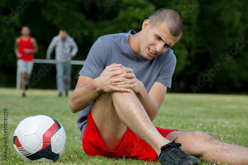 Canvas Print close-up of an injured male soccer player on field