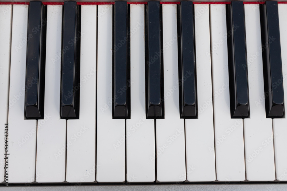 close-up of piano keys. close frontal view, black and white piano keys, viewed from above close-up of piano keys. close frontal view, black and white piano keys, viewed from above
