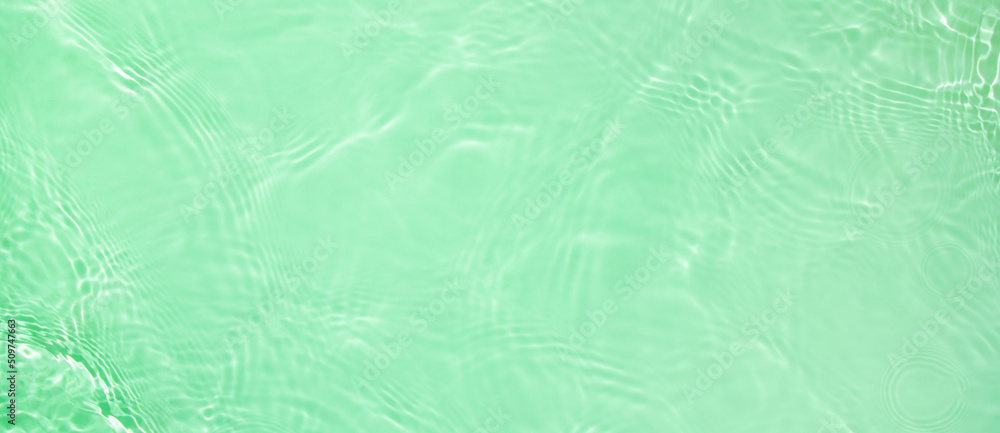 Abstract summer banner background Transparent green clear water surface texture with ripples and splashes. Water wave in sunlight, copy space, top view Cosmetics moisturizer micellar toner emulsion Abstract summer banner background Transparent green clear water surface texture with ripples and splashes. Water wave in sunlight, copy space, top view Cosmetics moisturizer micellar toner emulsion