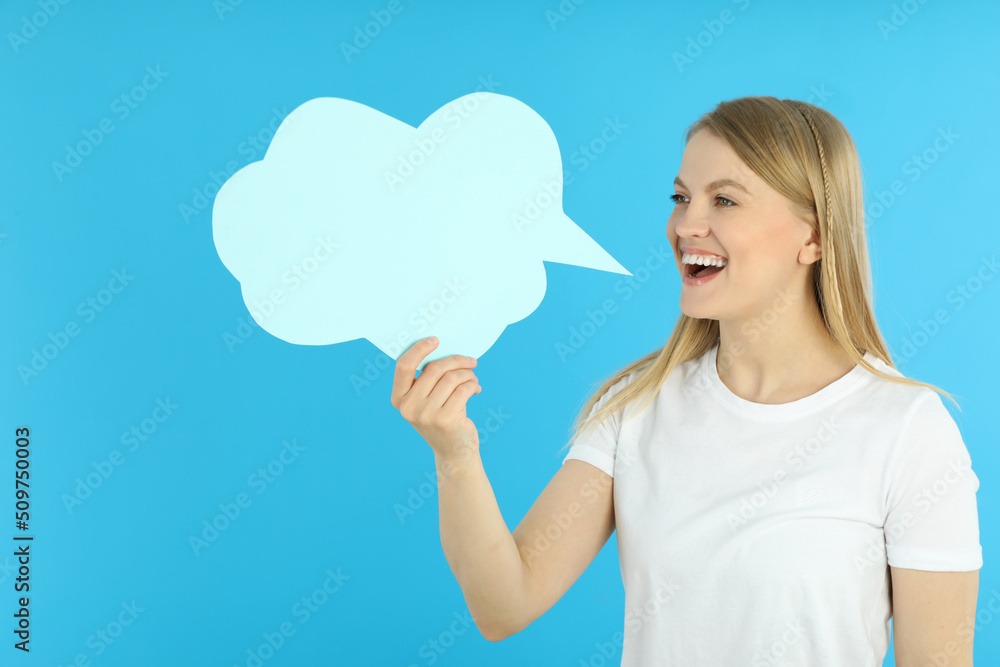 Young woman and talk cloud on blue background Young woman and talk cloud on blue background
