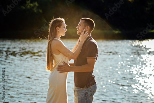 Declarations of Love, Candid couple in love holding hands on nature background.