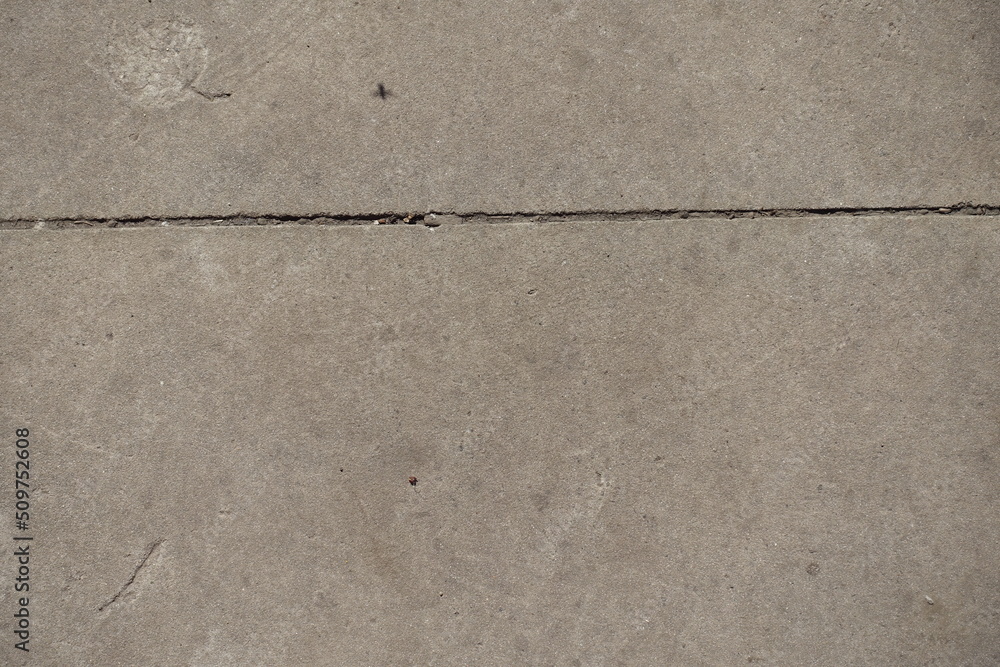 Obraz premium One horizontal joint between two simple gray concrete slabs
