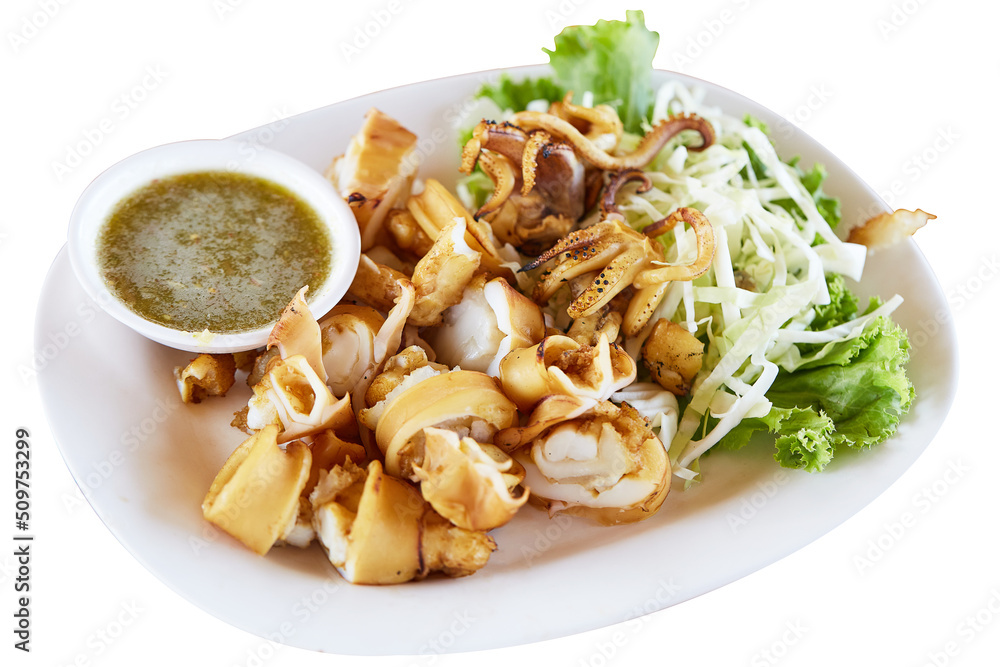 Grilled squid, squid eggs and sliced squid tentacles on white plate and spicy and sour seafood sauce, popular seafood. Grilled squid isolated on white background, It's high-calorie food.