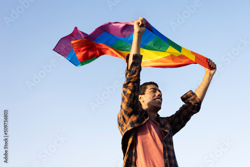  Happy man with a pride flag. LGBT community.