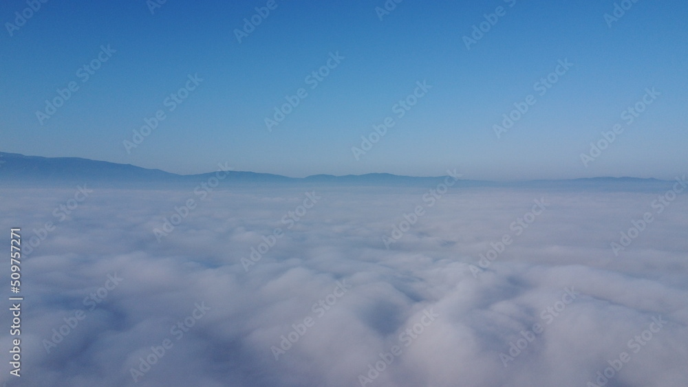 Above the fog in the morning. Above the clouds. Above the fog in the morning. Above the clouds.