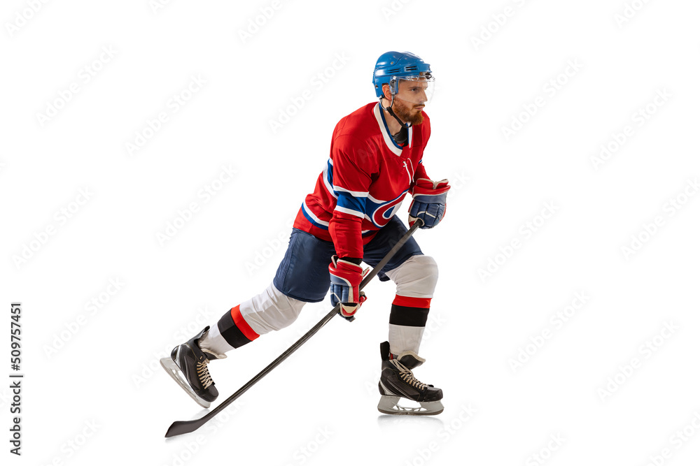 Obraz premium Young male hockey player in sports uniform and protective equipment training isolated on white background. Concept of sport, healthy lifestyle, motion, movement, action.