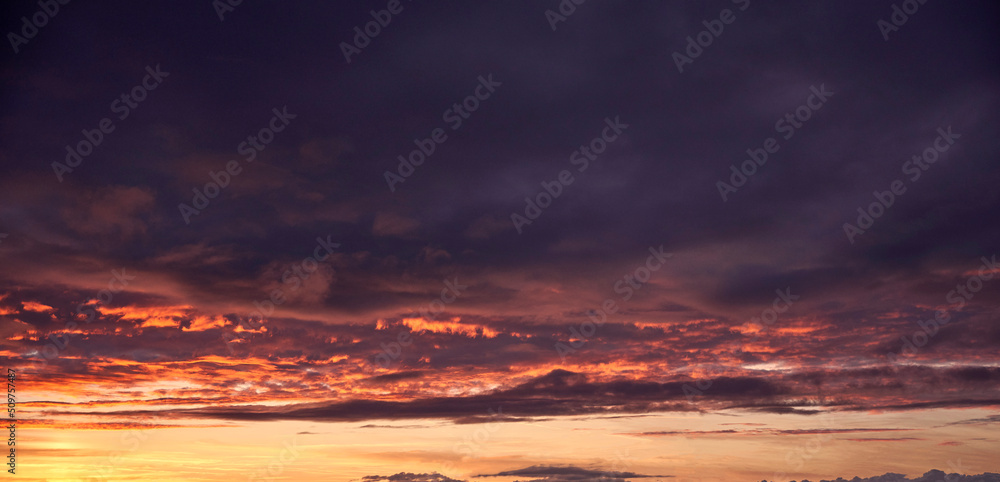 Beautiful natural sky with clouds at sunset, colorful.