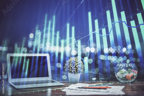 Forex market graph hologram and personal computer on background. Double exposure. Concept of investment.