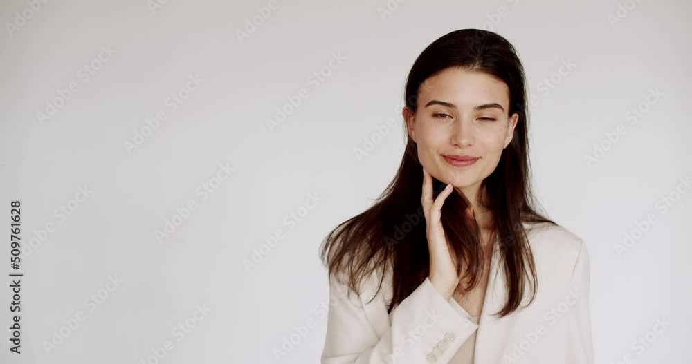 Beauty woman smiling with face healthy clean fresh skin beauty female model on white isolated wall. The concept of perfect young skin and beauty. Beauty video concept, close up portrait. Happy woman. Beauty woman smiling with face healthy clean fresh skin beauty female model on white isolated wall. The concept of perfect young skin and beauty. Beauty video concept, close up portrait. Happy woman.