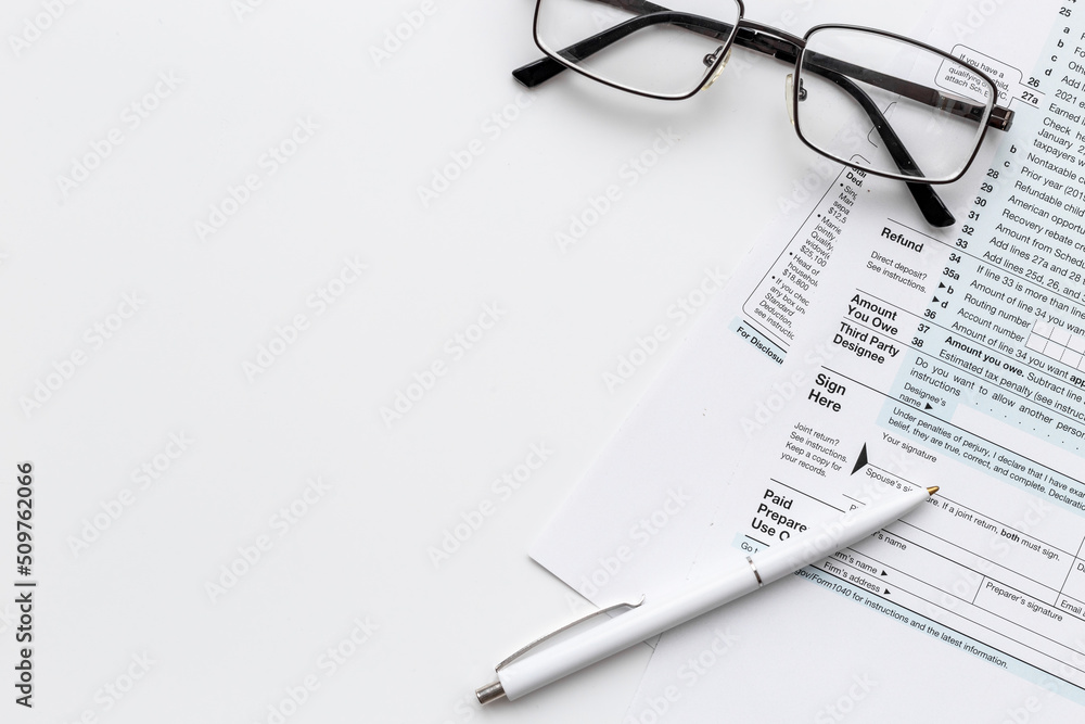 Pen on US individual tax form. Tax payment season Pen on US individual tax form. Tax payment season