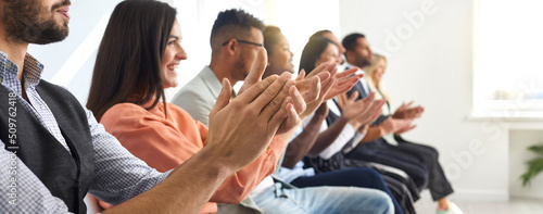 Web banner of excited diverse businesspeople clap hands meet welcome presenter or speaker at seminar or conference. Happy audience applaud thanking for presentation. Acknowledgment concept. photo