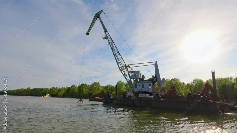 Cleaning and deepening the river for navigation. Dredging boat is working to deepen the fairway on the river Cleaning and deepening the river for navigation. Dredging boat is working to deepen the fairway on the river