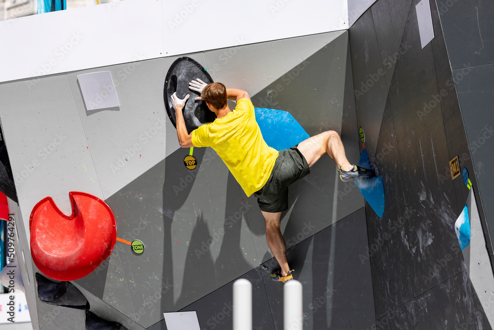 Climbing. Sport. Young person climbing in Block Climbing. Olympic