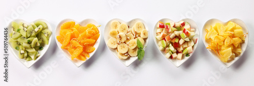 Various fruits in heart bowls.