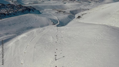Aerial view snow mountain range landscape clouds in background 4k winter drone footage Ski resort. Erciyes. Turkey. Volcano. Ropeway. aerial truck left. High quality 4k footage