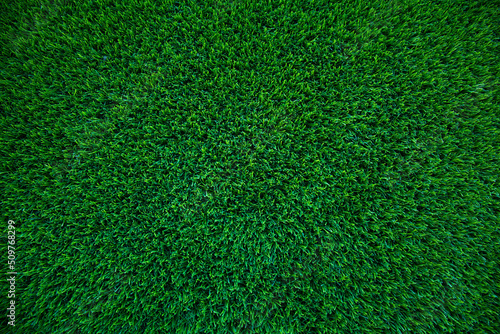 Top view of artificial green grass texture for background. Abstract concept design picture backdrop for golf course and sports soccer field or add text message.