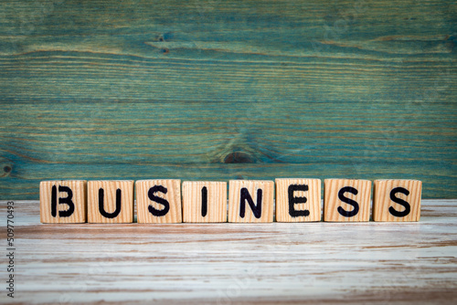 Wallpaper Mural Business. Wooden alphabet letters on a green and white background Torontodigital.ca