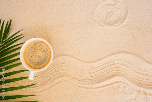 background with sand and cup coffee