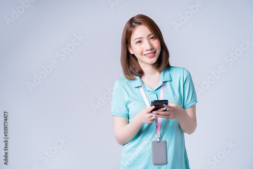 Portrait of young Asian businesswoman on white background