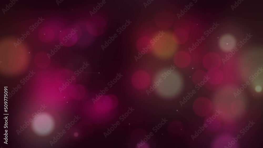 Animation of pink and orange bokeh moving on black background