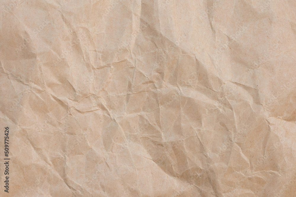 Fototapeta premium Crumpled brown paper texture background