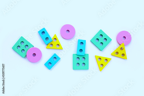 Colorful wooden domino toys for children on white background.