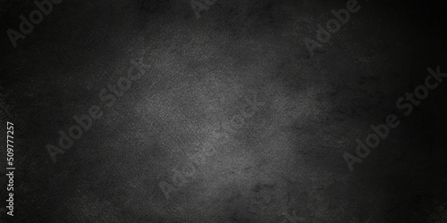 Foto Dark black grunge textured concrete background
