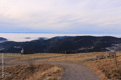 Blick vom Berg Belchen auf die Wolken behangenen Täler des Schwarzwalds	 photo