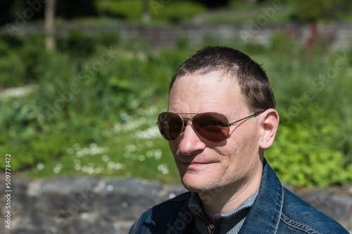Portrait of a 40 year old man with sunglasses