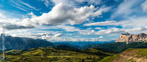 Pralongia high plateau with peaks of the Dolomites around and Zillertal Alps on the background