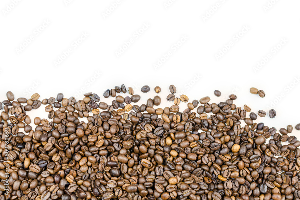 Brown roasted coffee beans on a white background. Coffee background. Space for the text. Brown roasted coffee beans on a white background. Coffee background. Space for the text.