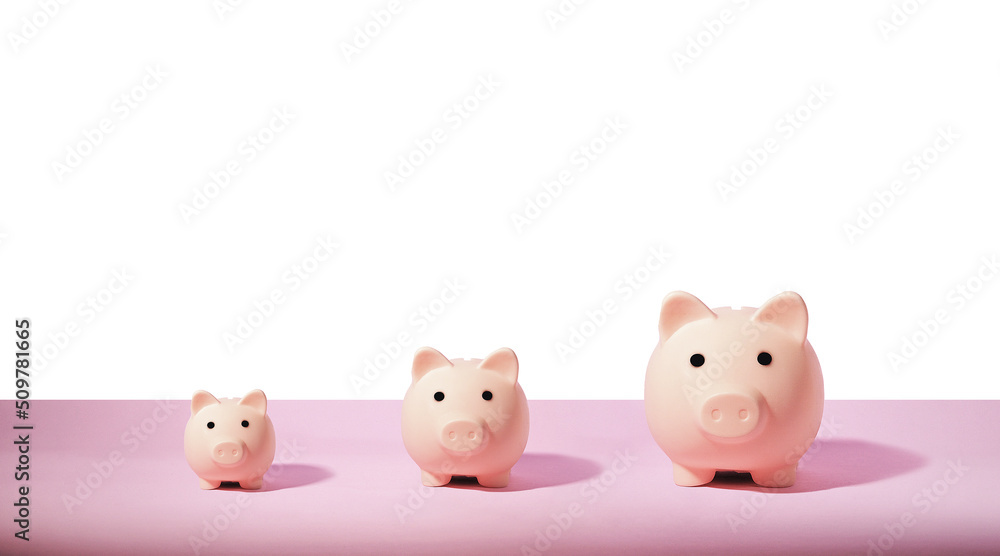 Piggy bank isolated on pink background. Saving money concept. Piggy bank isolated on pink background. Saving money concept.