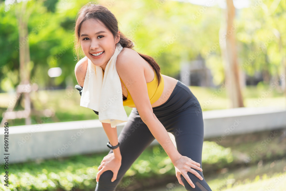Beautiful Girl Jogging In The Park. Looking At Camera. Stock Photo