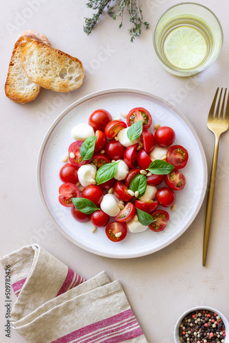 Salad with mozzarella  tomatoes  nuts and basil. Healthy eating. Vegetarian food. Diet.