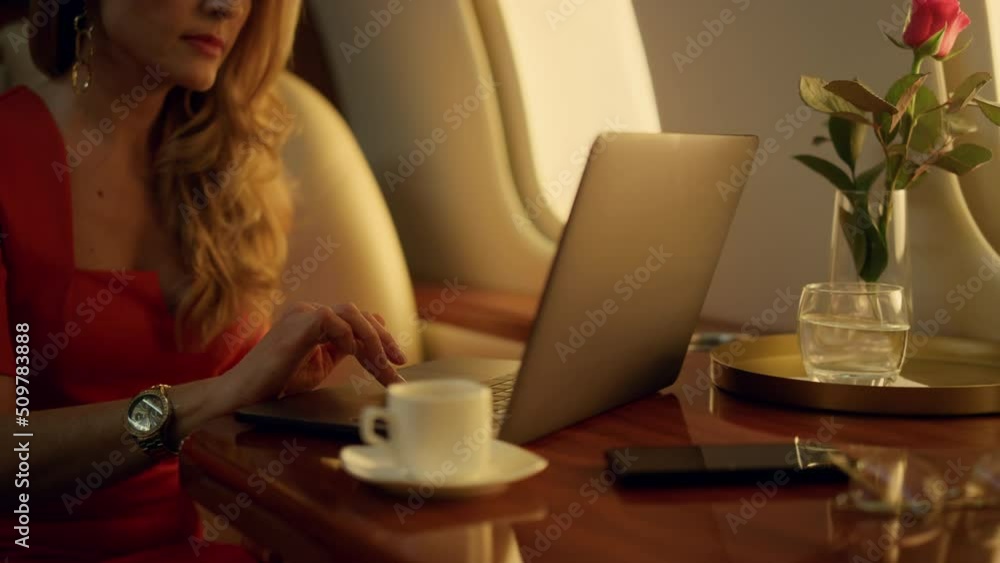 Luxury ceo working laptop on corporate trip closeup. Focused blonde drink coffee Luxury ceo working laptop on corporate trip closeup. Focused blonde drink coffee