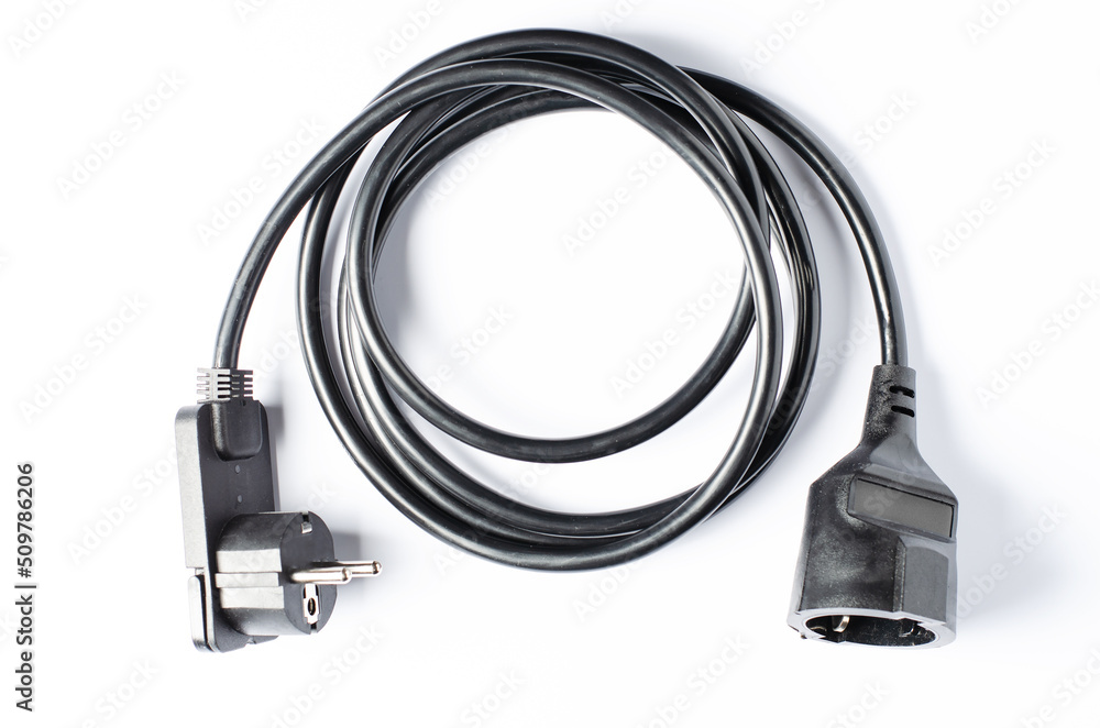 Black electric extension cord on a white background. Closeup Black electric extension cord on a white background. Closeup