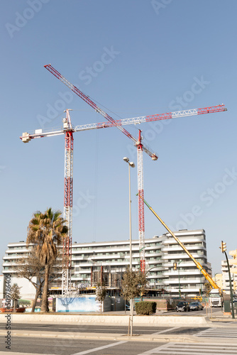 Cranes working on building under construction