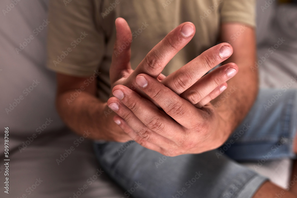 Adult man with hand and wrist pain. Adult man with hand and wrist pain.