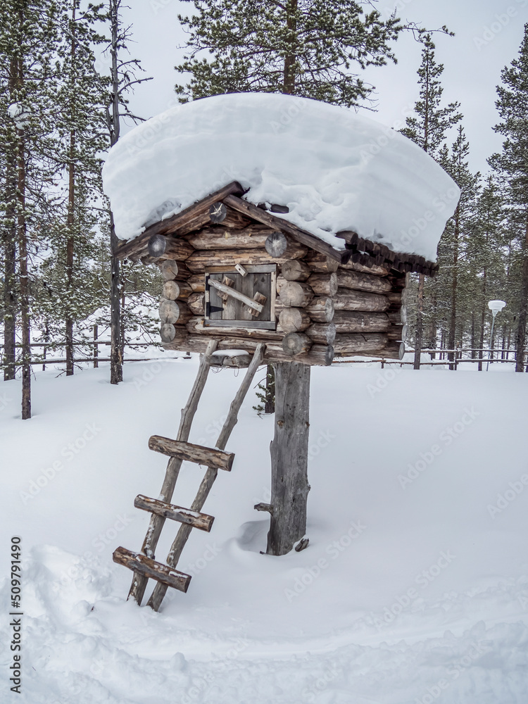 Old wooden hut in winter snowy forest in Finland, Lapland. Old wooden hut in winter snowy forest in Finland, Lapland.