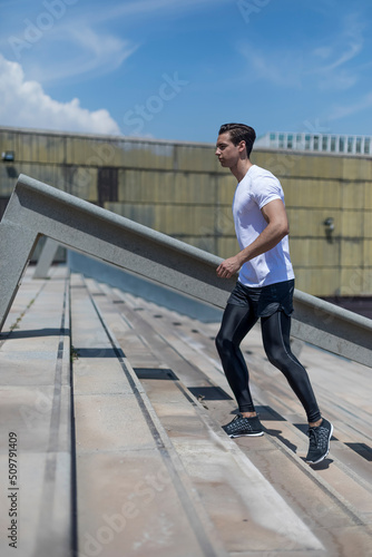 Young man doing interval workout on stairs