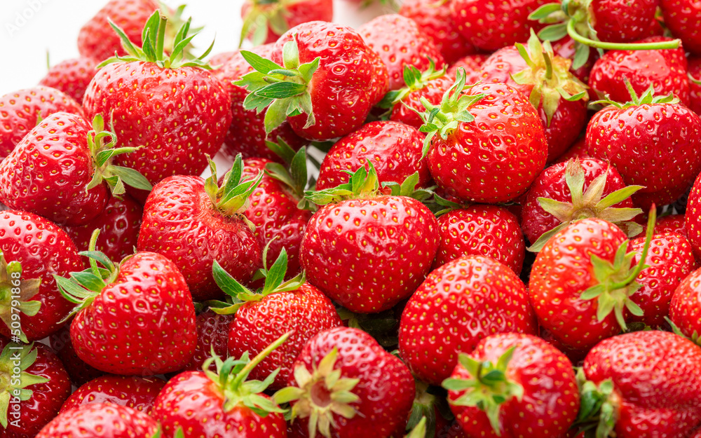 Ripe strawberries with green sepals. Background Ripe strawberries with green sepals. Background