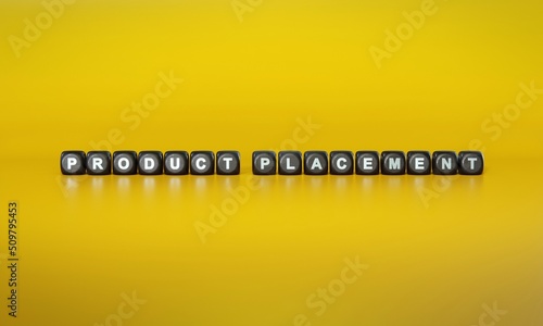 Words ‘Product placement’ spelled out in white text on dark wooden blocks against plain yellow background. 3D rendering © HTGanzo