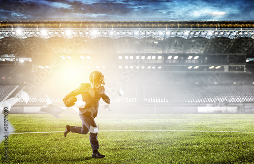 Businessman acting as american football players