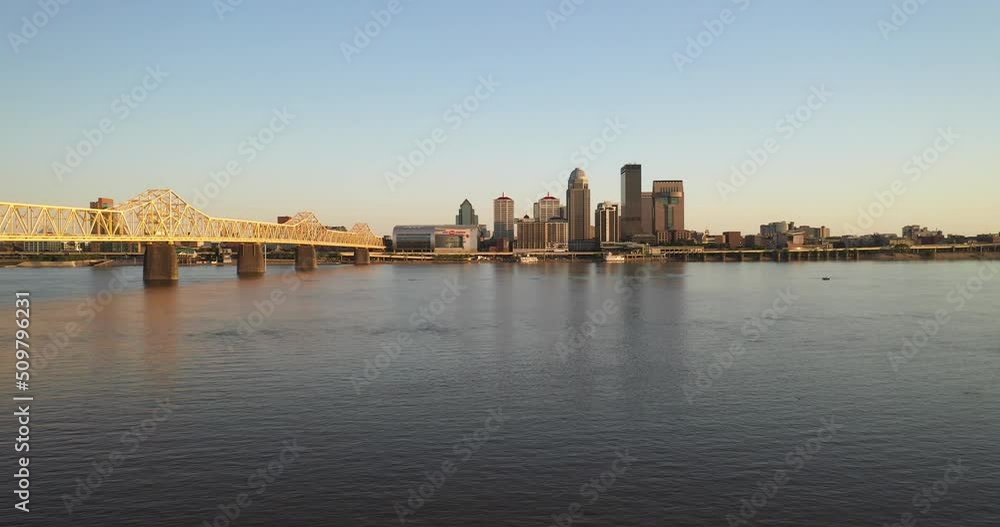 Louisville, Kentucky skyline with bridge and trees with drone video moving forward. Louisville, Kentucky skyline with bridge and trees with drone video moving forward.