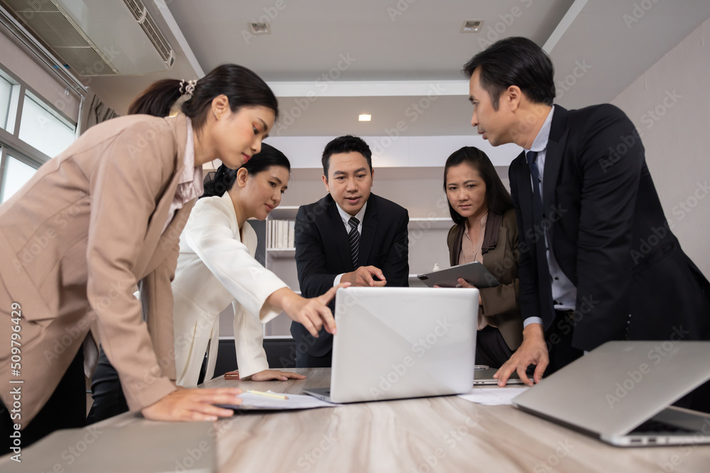Group of Asian Business Team Having a Brainstorm in a Meeting Group of Asian Business Team Having a Brainstorm in a Meeting