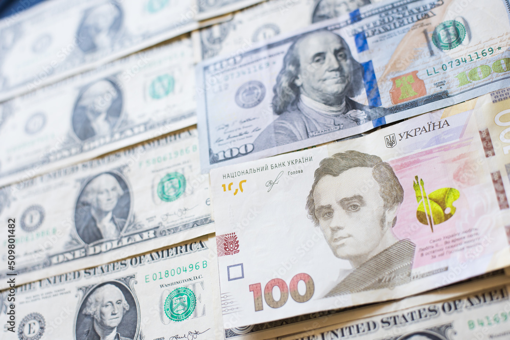 Ukrainian hryvnia money on a background of dollars Ukrainian hryvnia money on a background of dollars