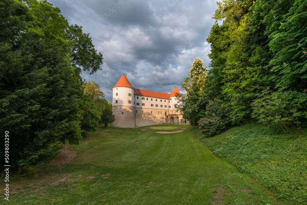 Castle Mokrice on a spring evening with dramatic clouds and forest. A fortress in the woods.
Castle Mokrice on a spring evening with dramatic clouds and forest. A fortress in the woods.
