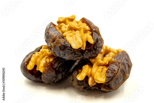 Walnut-stuffed dates isolated on white background. Close-up. Arabian luxury for special occasions such as Ramadan and Eid holidays. local name cevizli hurma