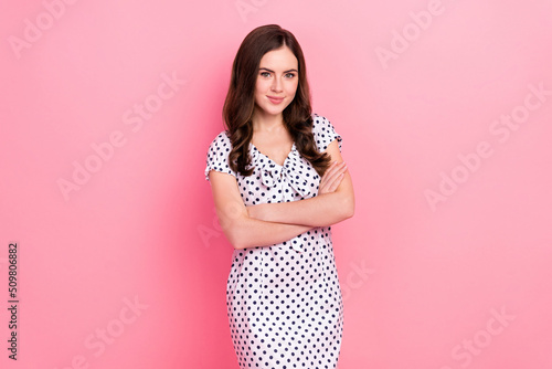 Photo of cute shiny woman wear white dress arms folded smiling isolated pink color background © deagreez