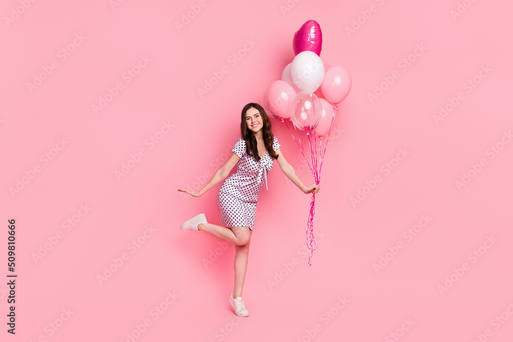 Photo of funky charming lady dressed dotted dress holding balloons dancing isolated pink color background